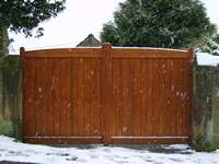 A Eastwood style gate made from softwood and stained in medium oak stain