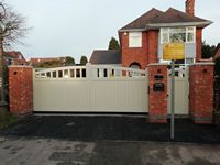 A sliding gate color matched to Farrow and Ball 'Drop Cloth'.